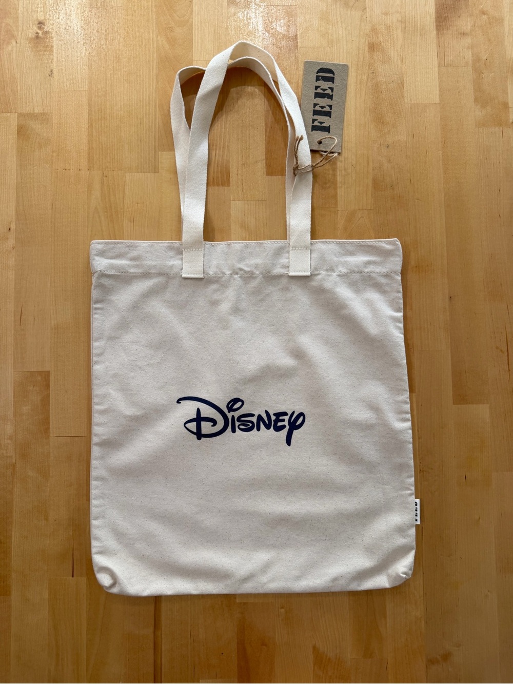 Feed NWT Disney Cream Canvas Tote with Navy Logo